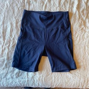 Athleta Navy Ultimate Stash Pocket 7” short